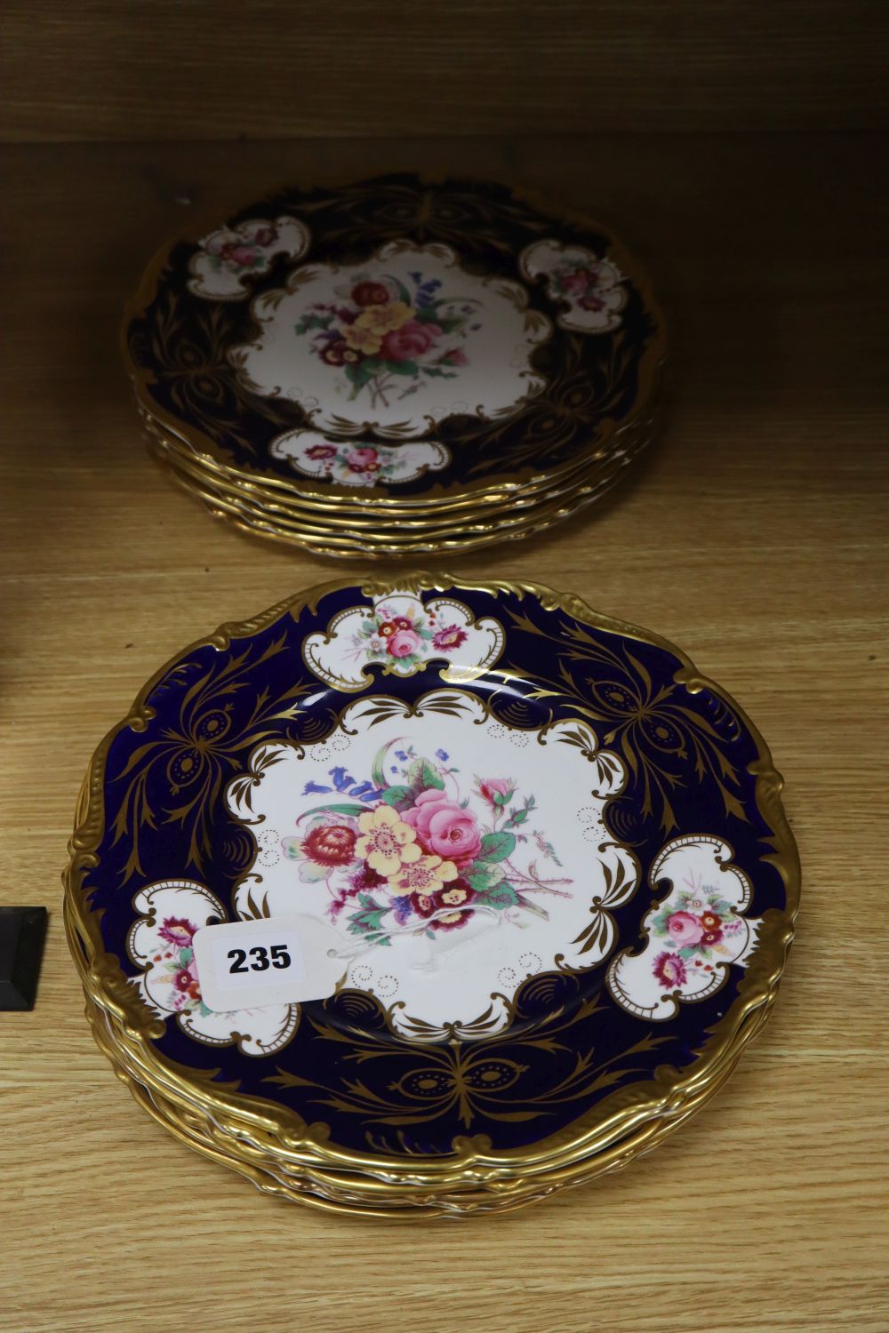 A set of twelve Coalport floral painted plates with gilt border, diameter 27cm